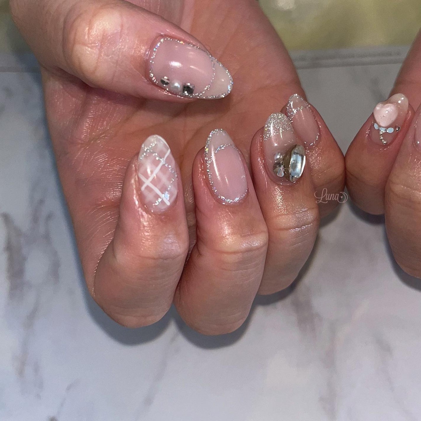 Iuna. Mizuki on LIPS 「.スペシャルプラン🎀片手はお揃いにしてくださいました🤍#nai..」(2枚目)