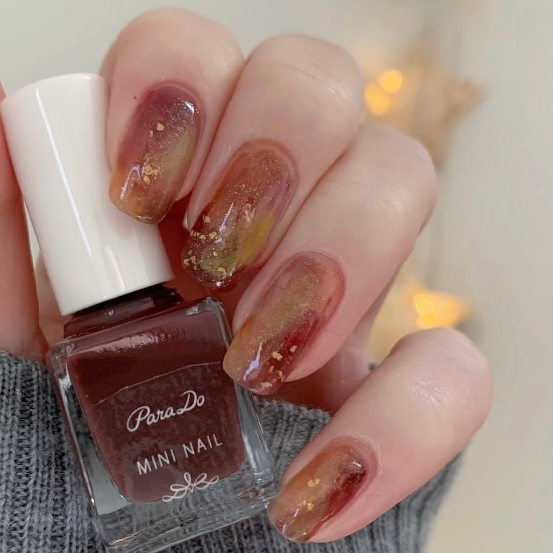 yomogi on LIPS 「#アースカラーで輝く指先紅葉をイメージしたネイルアレンジ💅🍁..」(1枚目)