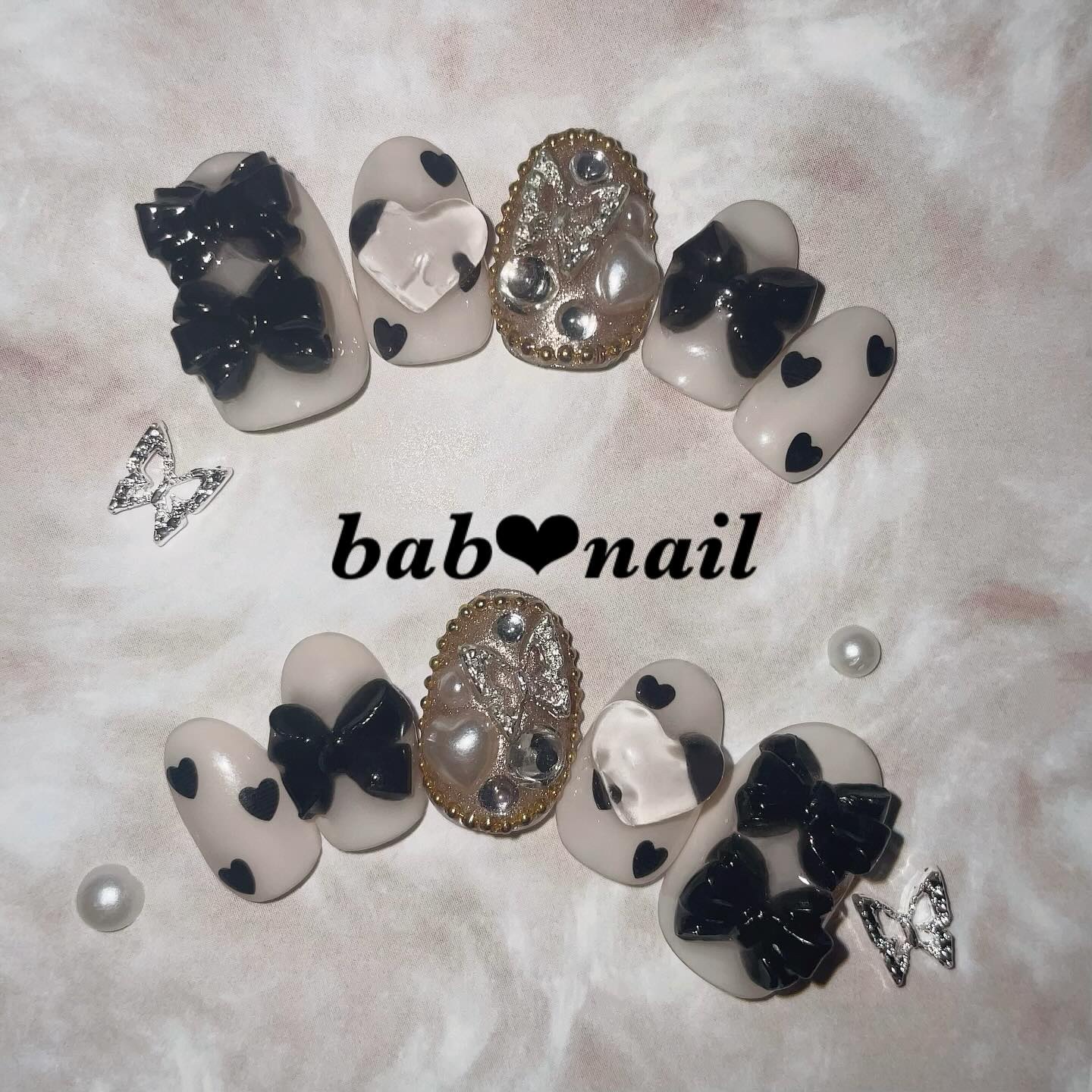 #リボンネイル,#ハートネイル,#蝶々ネイル,#モノトーンネイル,#ガーリーネイル,#大人可愛いネイル,#立体リボンネイル,#ぷっくりハートネイル,#個性派ネイル,#パーティーネイル,#デートネイル,#韓国ネイル,#姫系ネイル,#主役級ネイルのネイルデザイン