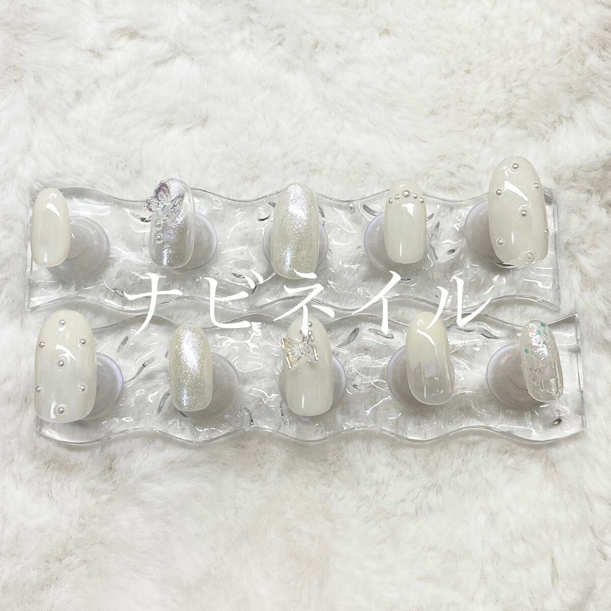 あみ on LIPS 「ナビネイル蝶々のパーツがポイント#🦋#ネイル#ホワイトネイル#..」(1枚目)