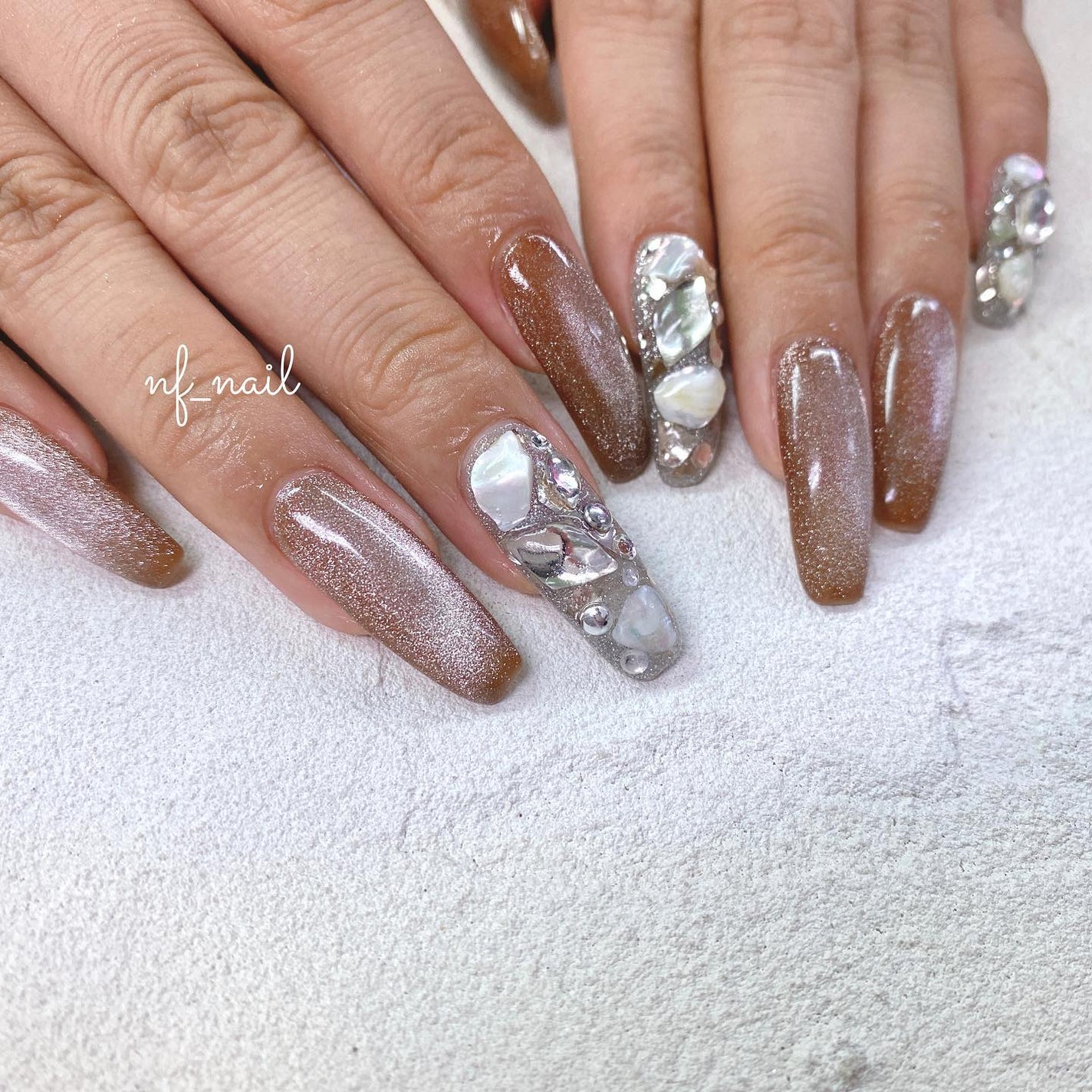 Natsumi◎nailist on LIPS 「.ブラウンマグネット🤎持ち込み¥9,980.#ネイル#ネイルテ..」(1枚目)